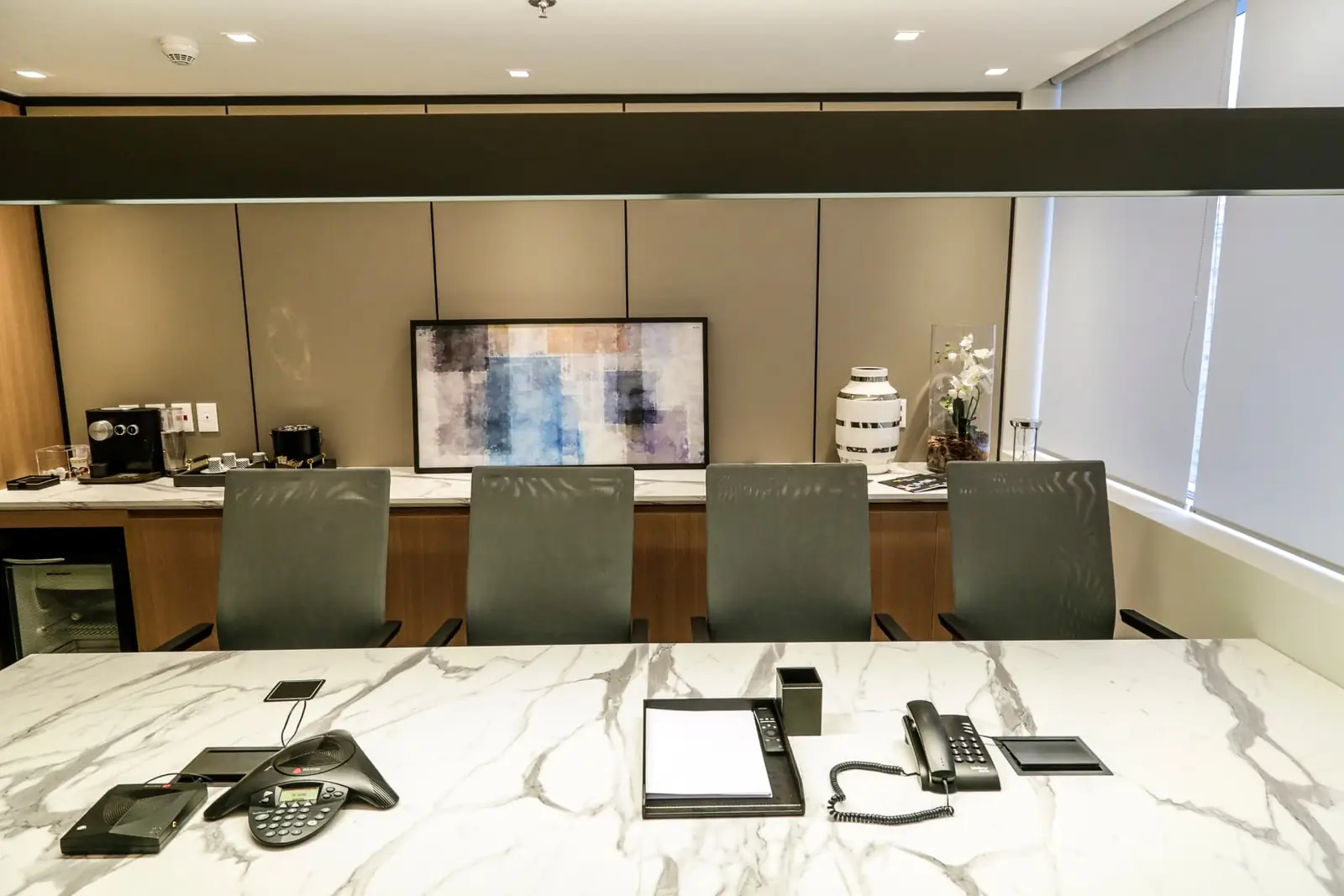 Marble meeting room at JK Capital's office, the environment where M&A transactions are conducted